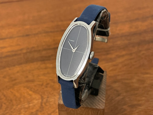 Front side (1970s) Timex 519-105 dress watch - elongated oval case - black cross dial  - small size (NOS + full set)