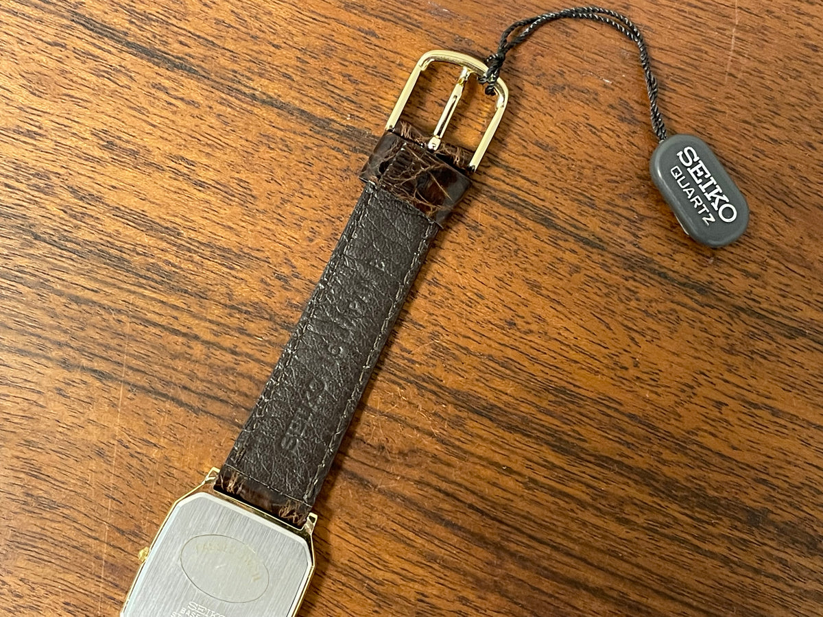 (1987) Seiko 5E20-5A00 "Tank" dress watch - champagne patterned dial w/ gold markers (NOS)