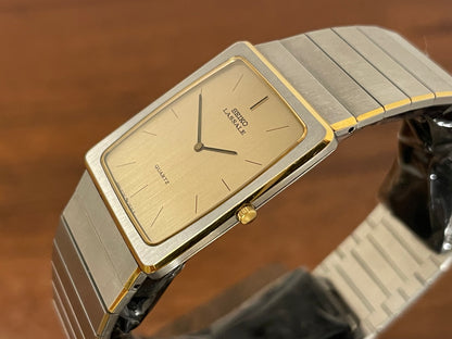 (1983) Seiko 6730-565H Lassale ultra thin - stainless steel bracelet - brushed gold dial w/ black stick markers (NOS)