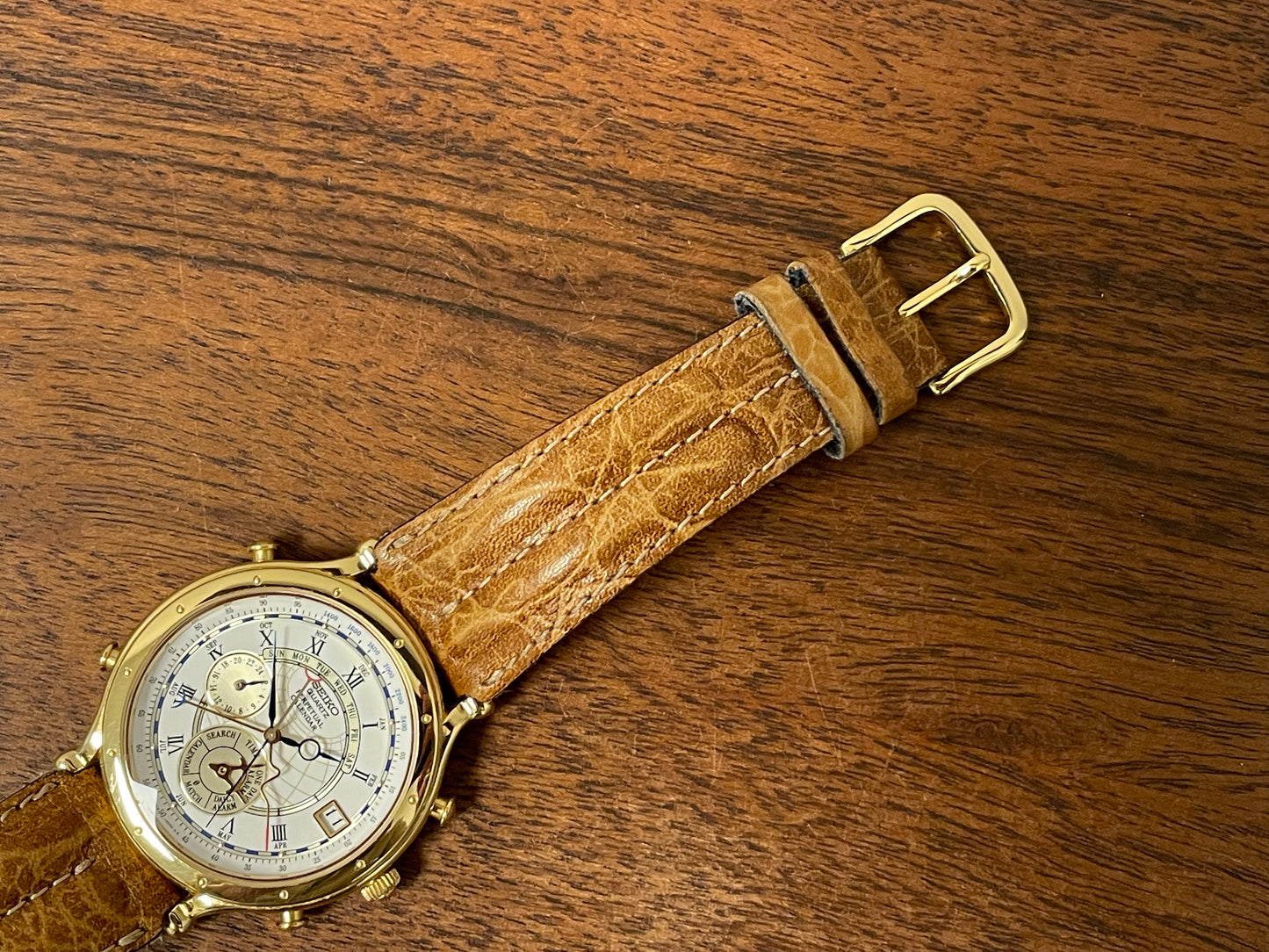 (1994) Seiko 6m13-0010 Age of Discovery (AOD) Perpetual Calendar - gold colored case - white dial w/ black Roman numerals