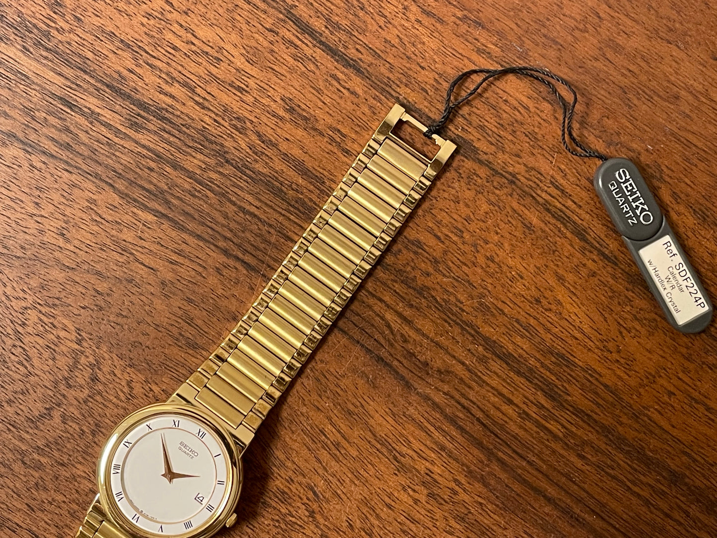 (1992) Seiko 5Y89-7A10 dress watch – white dial w/ Roman numerals & date (NOS)