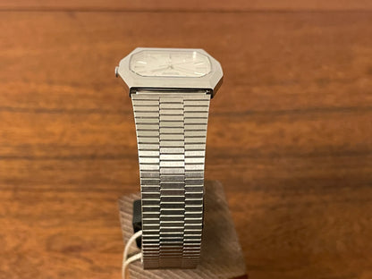 (1977) Ricoh 702008SS dress watch - silver brushed dial w/ silver markers (NOS)