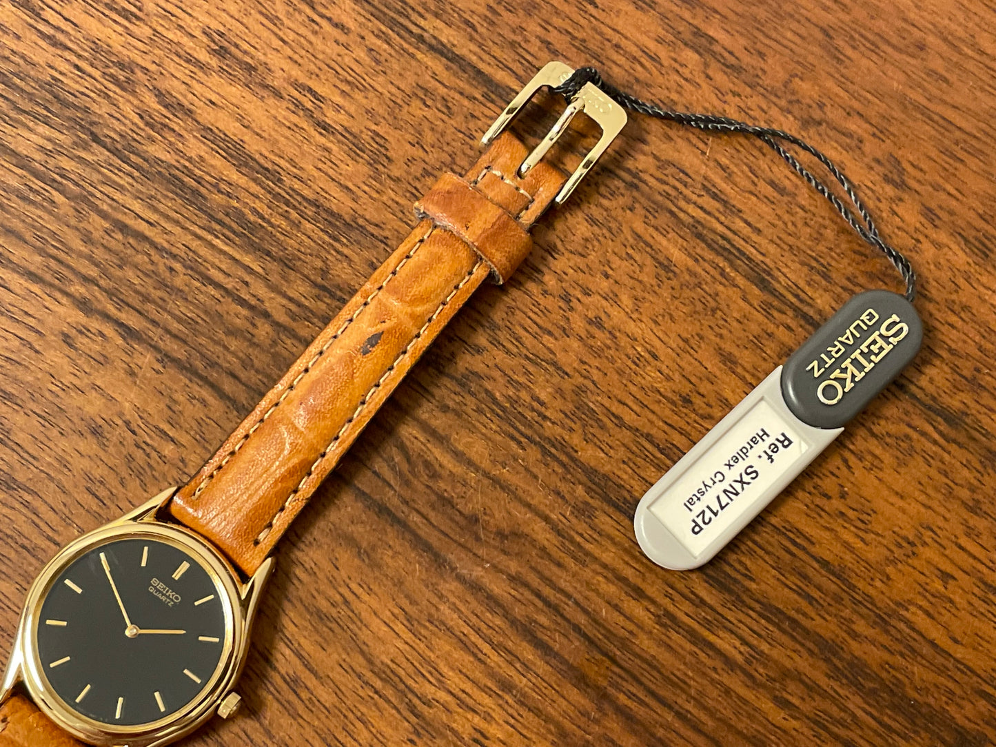 (1993) Seiko 4N00-0591 dress watch - gold bezel w/ black dial and gold markers - small size (NOS)
