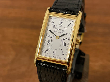 (1998) Tiffany & Co. Portfolio "Tank" dress watch - gold case - white dial w/ black Roman numerals (Mint)