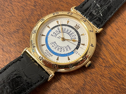 (1999) Pulsar V339-6000 world Timer - gold case - rotating white dial w/ gold markers (NOS)