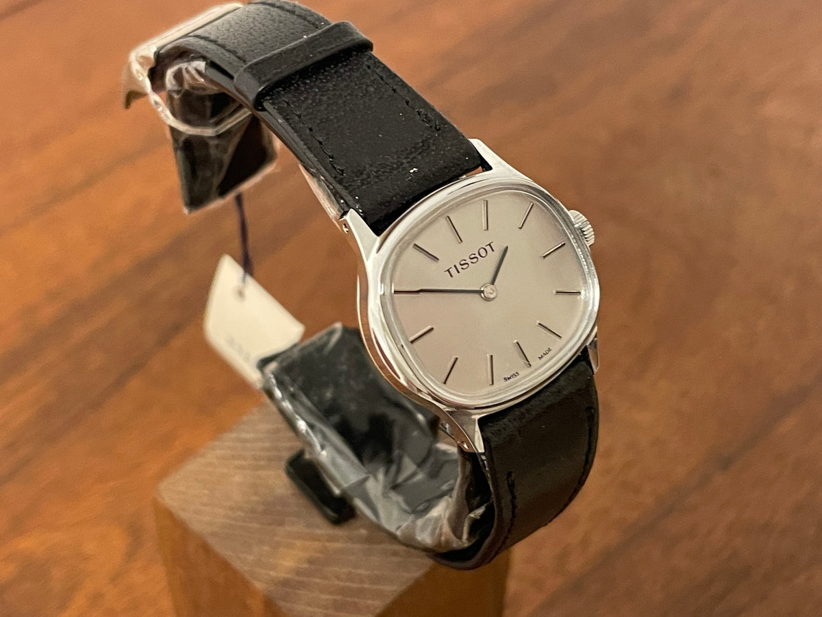 (1970s) Tissot 052-15007 Stylist dress watch - silver cushion case - silver brushed dial w/ silver stick markers - small size (NOS)