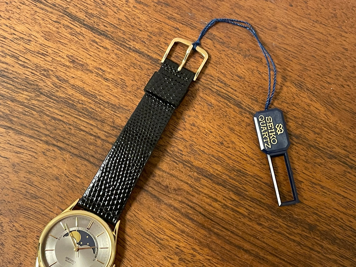 (1986) Seiko 7434-7000 dress watch with moon phase -silver dial w/ gold stick markers (NOS)