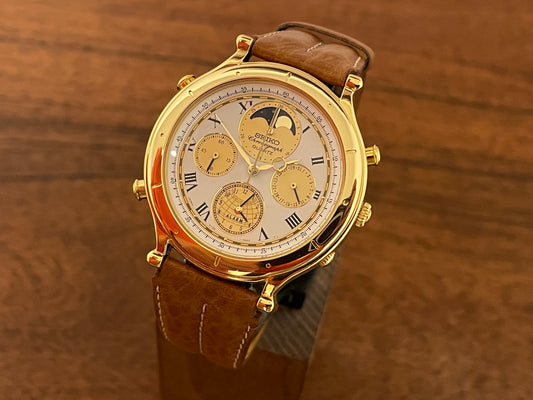 Front side (1990) Seiko 7T36-7A10 Age of Discovery (AOD) chronograph - gold colored case - white dial w/ gold subdials & moonphase