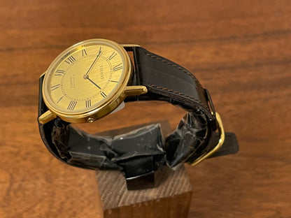 (1970s) Tissot 40771 Stylist dress watch - gold case - brushed gold dial w/ black Roman numerals (NOS)