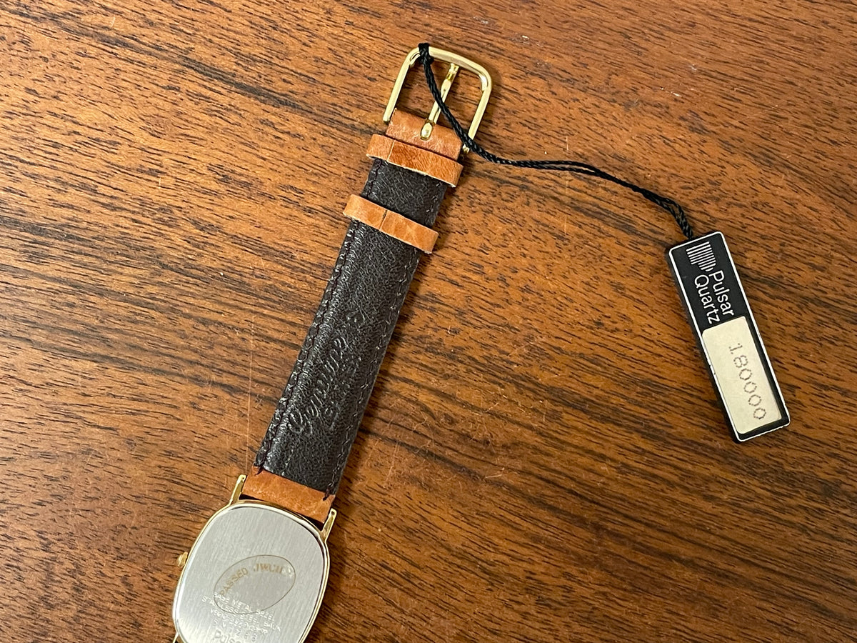 (1985) Pulsar V320-5029 "Ellipse" dress watch - gold case - diamond dust dial (NOS)