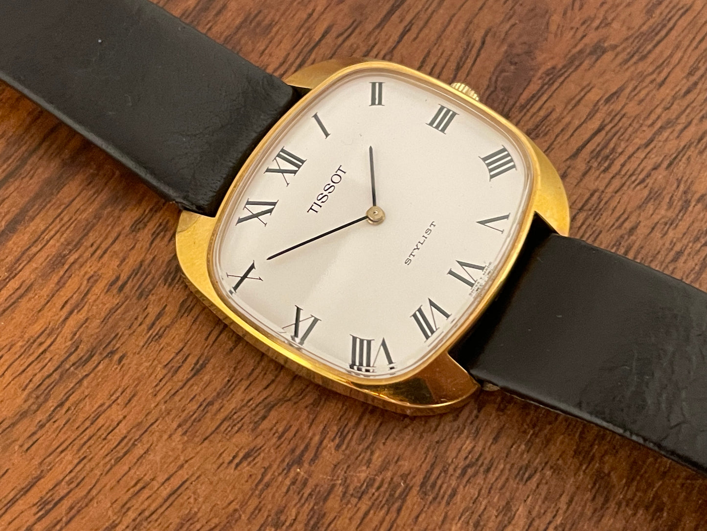 (1970s) Tissot Stylist dress watch - gold “tv case” - white dial w/ black Roman numerals (NOS)