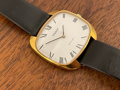 (1970s) Tissot Stylist dress watch - gold “tv case” - white dial w/ black Roman numerals (NOS)