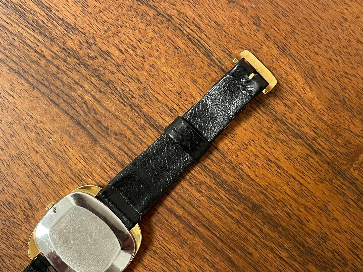 (1970s) Tissot Stylist dress watch - gold “tv case” - white dial w/ black Roman numerals (NOS)