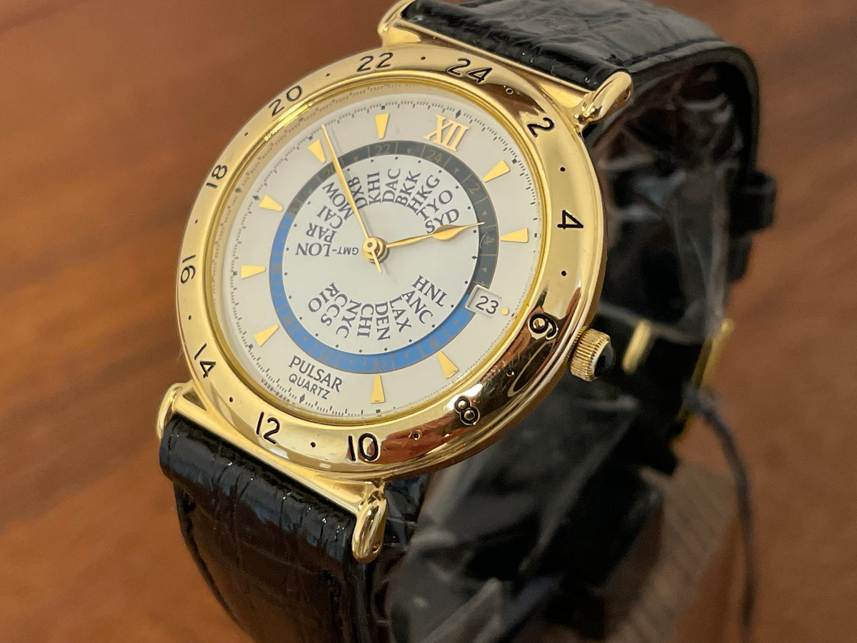 (1999) Pulsar V339-6000 world Timer - gold case - rotating white dial w/ gold markers (NOS)