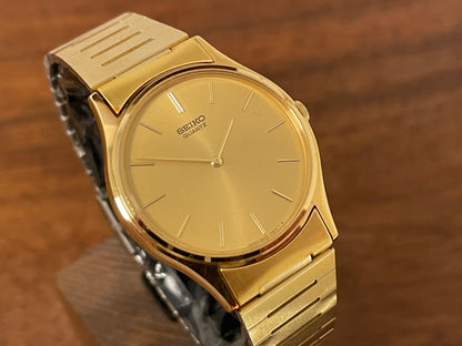 (1983) Seiko 8420-0140 dress watch - gold case - gold sunburst dial w/ gold stick markers (NOS)