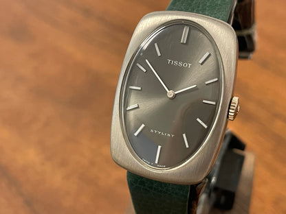 (1970s) Tissot Stylist dress watch - oval grey sunburst dial w/ white stick markers - small size (NOS)