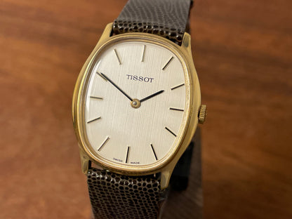 (1970s) Tissot 41141 "Ellipse" dress watch - gold case - silver brushed dial w/ gold stick markers (NOS)
