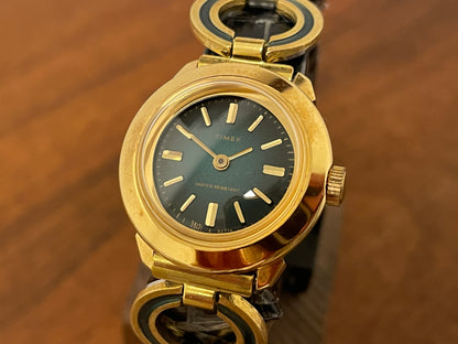 (1970s) Timex 551-211 dress watch - gold case - green dial w/ gold markers - small size (NOS + full set)