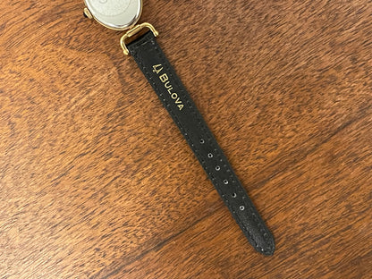 (1980s/1990s) Bulova Paris dress watch - oval case - cream dial w/ black Arabic numerals - small size (NOS)
