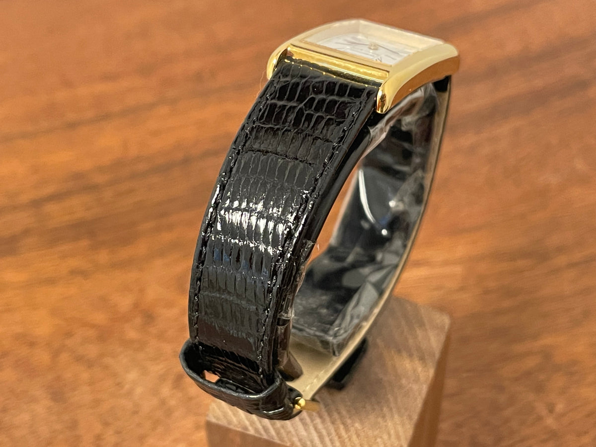 (1998) Tiffany & Co. Portfolio "Tank" dress watch - gold case - white dial w/ black Roman numerals (Mint)