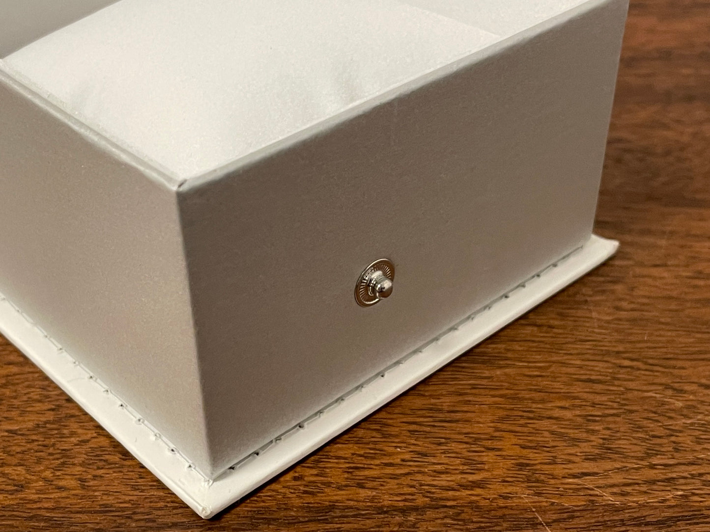 Casio watch box - white w/ fold-over lid and snap button closure