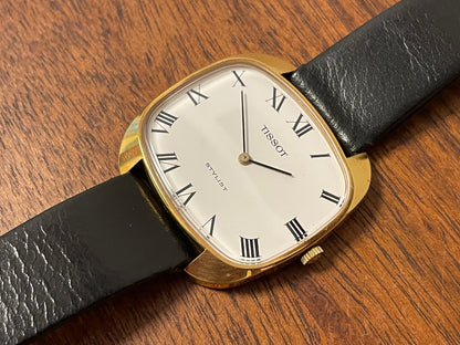 (1970s) Tissot Stylist dress watch - gold “tv case” - white dial w/ black Roman numerals (NOS)