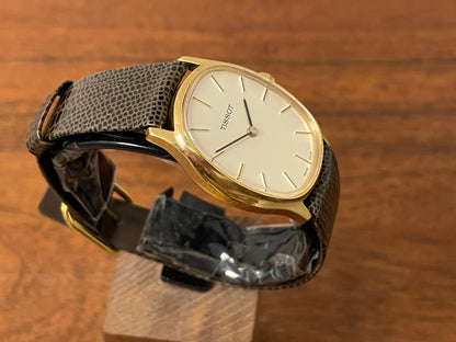 (1970s) Tissot 41141 "Ellipse" dress watch - gold case - silver brushed dial w/ gold stick markers (NOS)