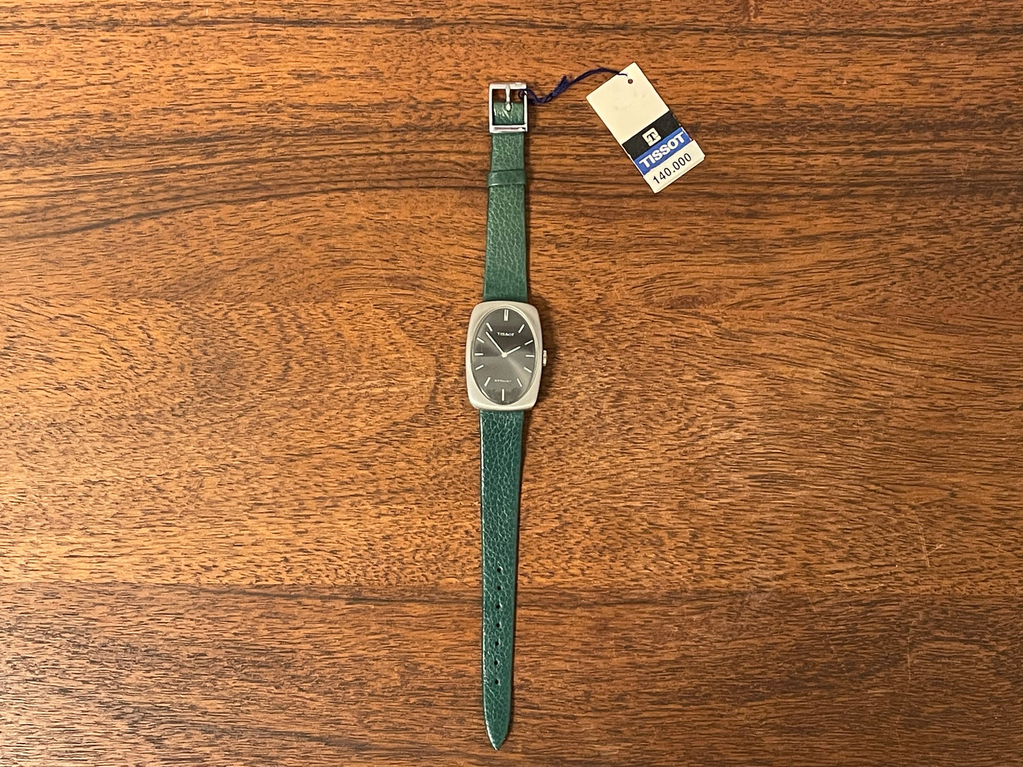 (1970s) Tissot Stylist dress watch - oval grey sunburst dial w/ white stick markers - small size (NOS)