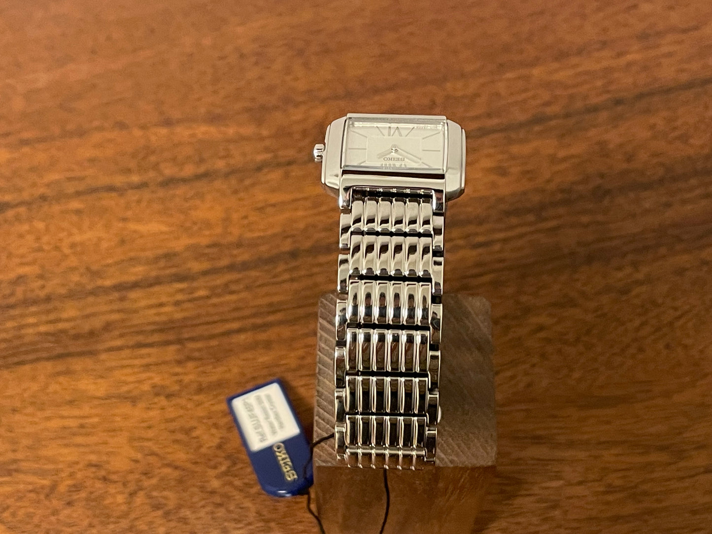 (1998) Seiko 1N00-0PT0 - rectangular case - silver dial w/ silver Roman numerals & markers - small size (NOS)