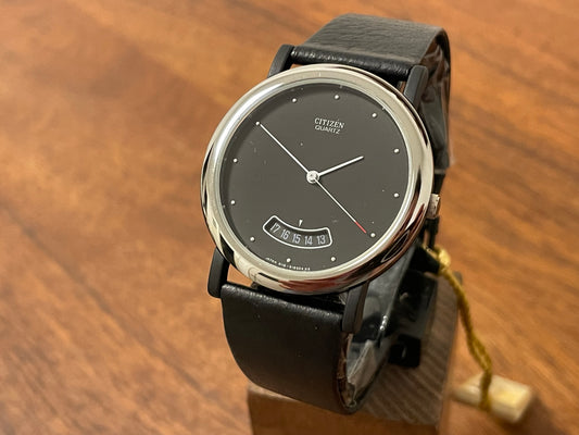 Front side (1989) Citizen QD9022-05E dress watch - black lugs - black dial w/ arc date window (NOS)
