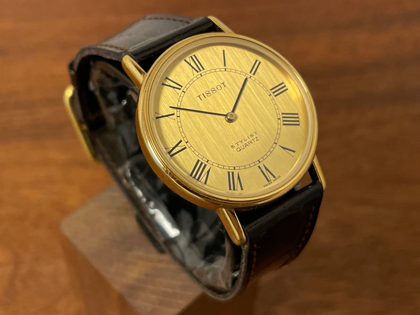 (1970s) Tissot 40771 Stylist dress watch - gold case - brushed gold dial w/ black Roman numerals (NOS)