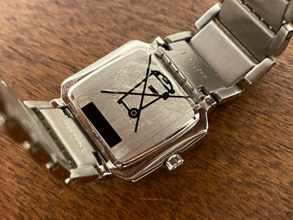 (1998) Seiko 1N00-0PT0 - rectangular case - silver dial w/ silver Roman numerals & markers - small size (NOS)