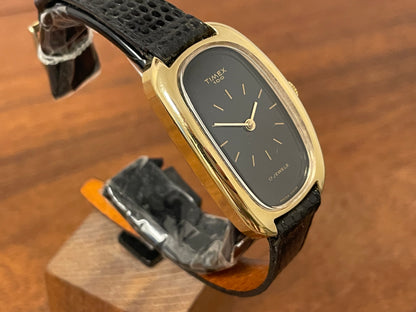 (1979) Timex 100 manual wind dress watch - Swiss made - tonneau case - black dial w/ gold markers