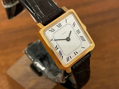 (1970s) Timex 527-201 "Tank" dress watch - gold case - white dial w/ Roman numerals - small size (NOS + Full set)