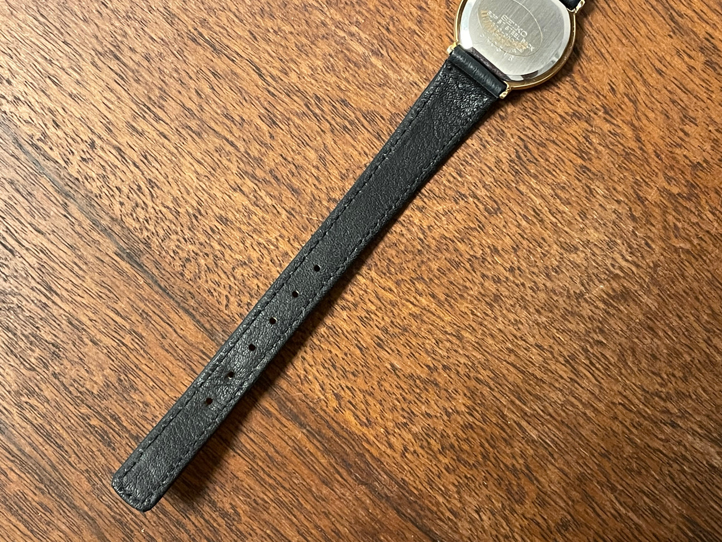 (1983) Seiko 7320-010A dress watch - purple bezel - dark blue dial w/gold markers - small size (NOS)