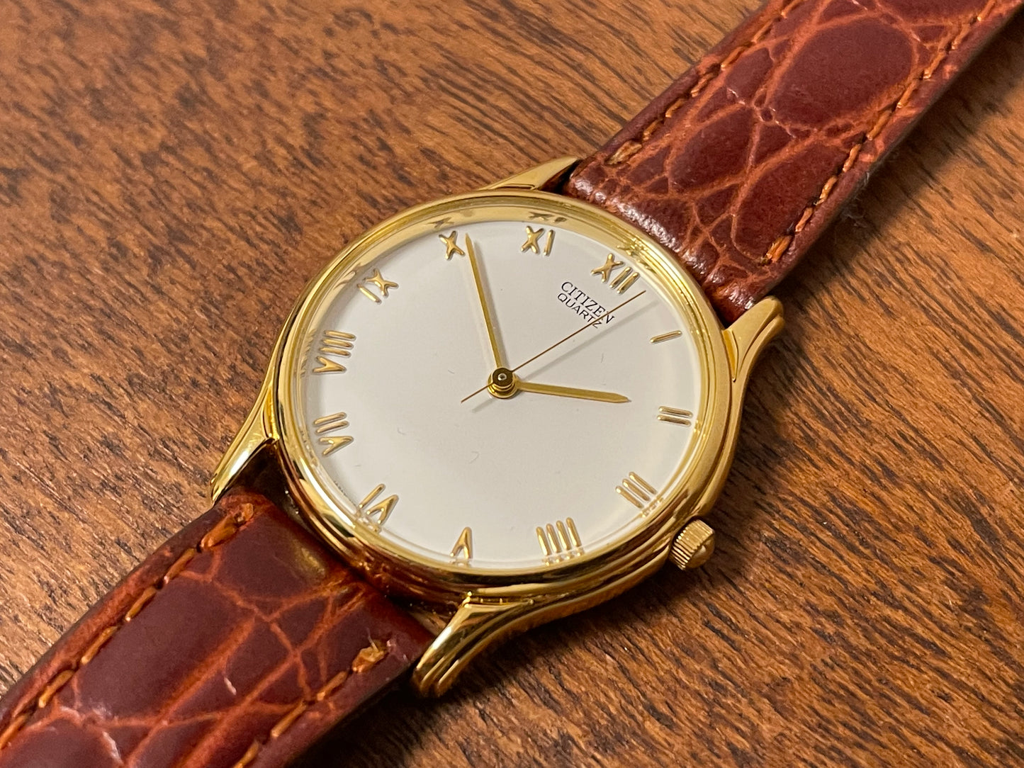 (1981) Citizen 6031-S38419 dress watch - white dial w/ gold Roman numerals - small size (NOS)