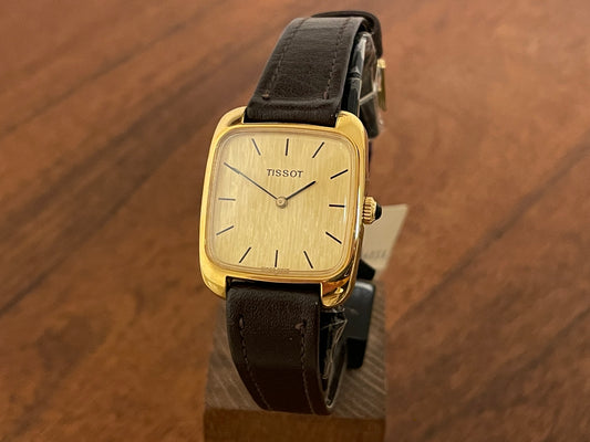 Front side (1970s) Tissot 642-10778 Stylist dress watch - gold square case - gold brushed dial w/ gold stick markers - small size (NOS)