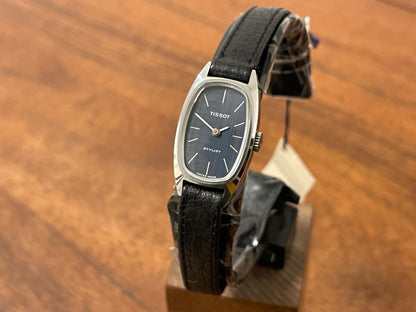 Front side (1970s) Tissot HZ-10720 Stylist dress watch - silver tonneau case - blue brushed dial w/ silver stick markers - small size (NOS)