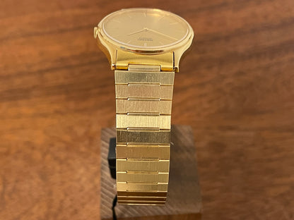 (1983) Seiko 8420-0140 dress watch - gold case - gold sunburst dial w/ gold stick markers (NOS)