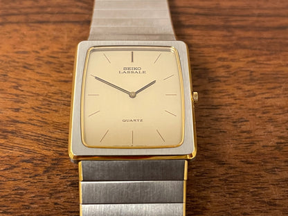 (1983) Seiko 6730-565H Lassale ultra thin - stainless steel bracelet - brushed gold dial w/ black stick markers (NOS)