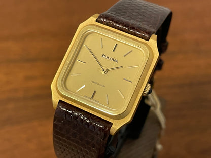 (1982) Bulova Longchamp "Tank" dress watch - gold case w/ champagne dial - small size (NOS)