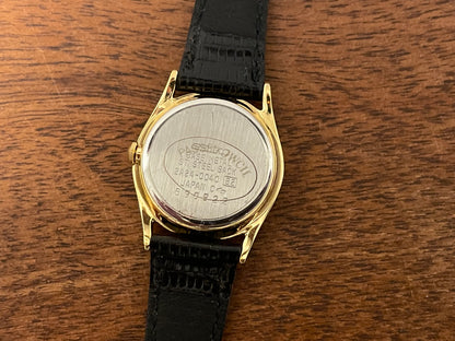 (1986) Seiko 2A24-0040 dress watch - white dial w/ moonphase & Roman numerals - small size (NOS)