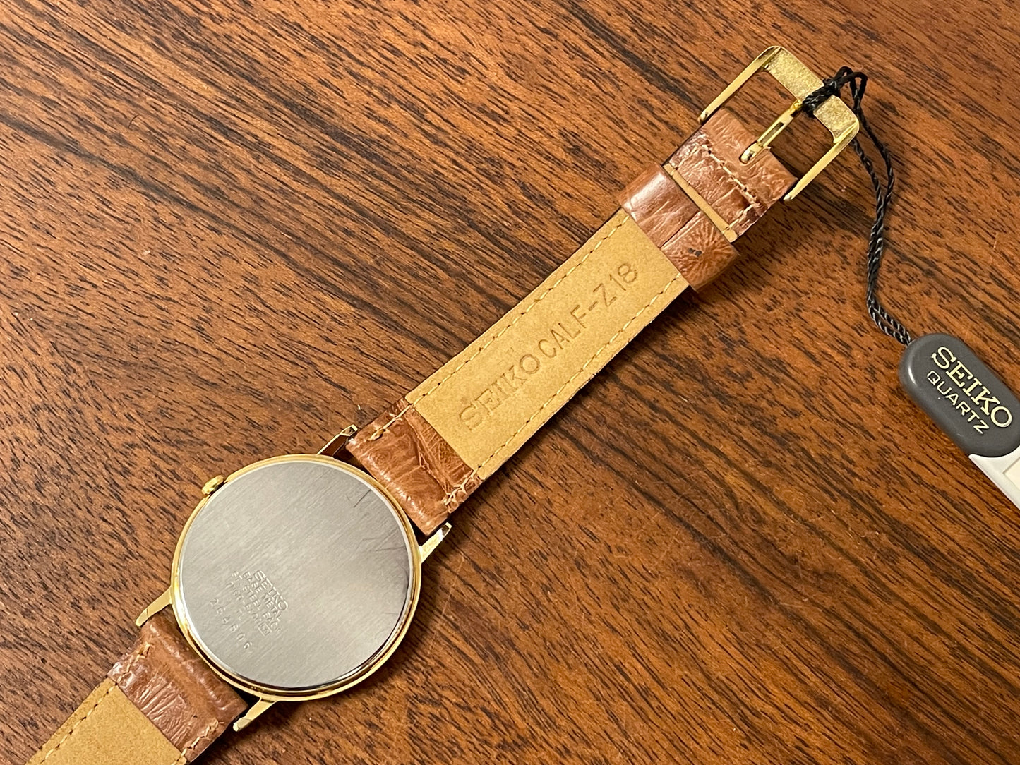 (1992) Seiko 7N00-6A00 dress watch - white dial w/ Roman numerals & Spade hands (NOS)