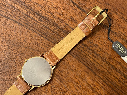 (1992) Seiko 7N00-6A00 dress watch - white dial w/ Roman numerals & Spade hands (NOS)