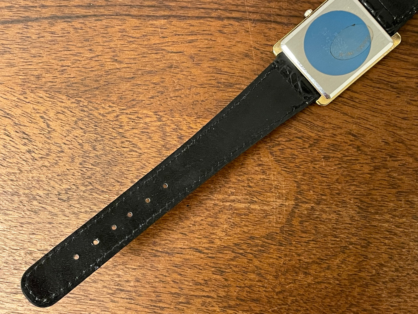 (1977) Ricoh 702009 quartz "Tank" dress watch - black dial w/ gold markers (NOS)