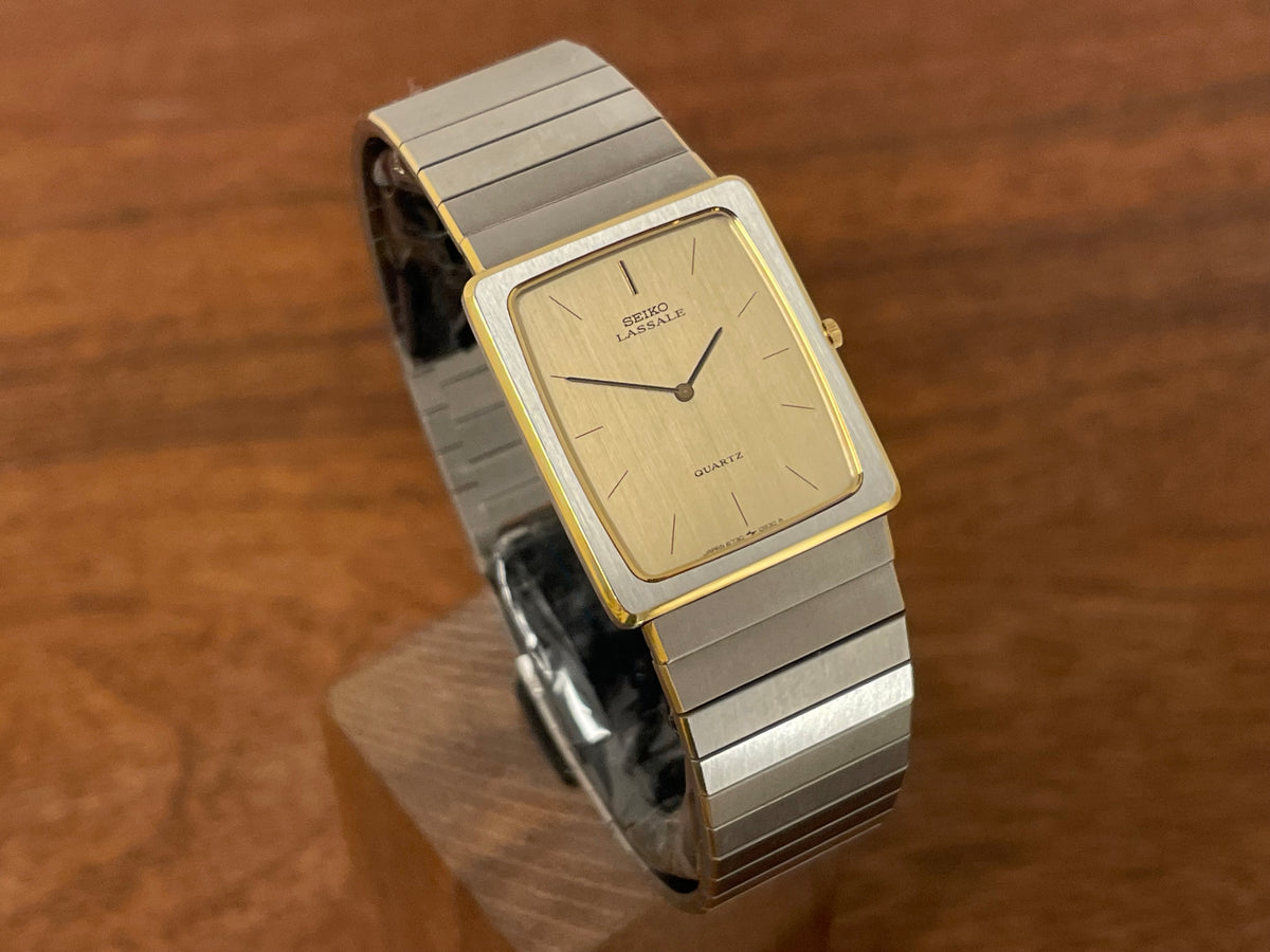 (1983) Seiko 6730-565H Lassale ultra thin - stainless steel bracelet - brushed gold dial w/ black stick markers (NOS)