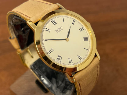 (1989) Seiko 5Y94-8000 dress watch - gold case - cream dial w/ black Roman numerals (NOS)