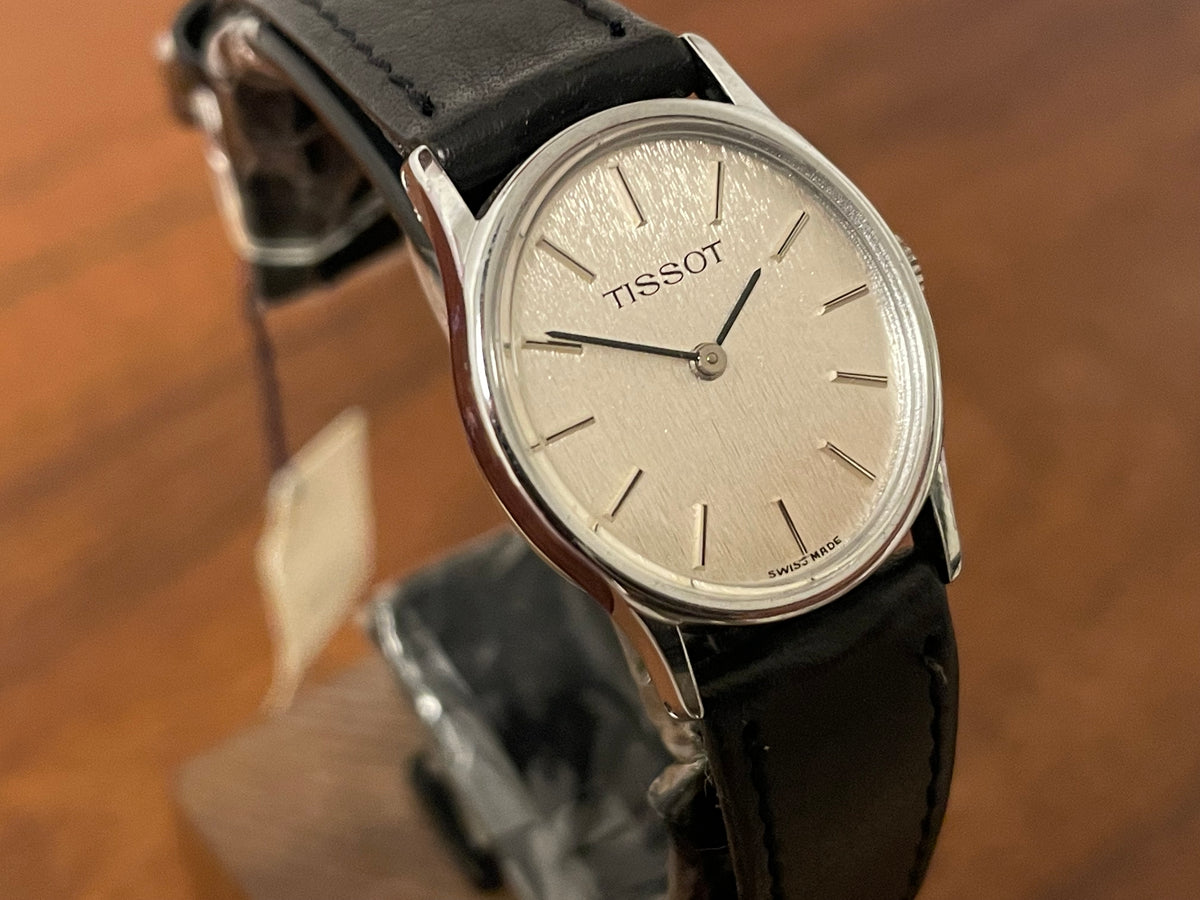 (1970s) Tissot 052-10991 Stylist dress watch - silver oval case - silverdust dial w/ silver stick markers - small size (NOS)