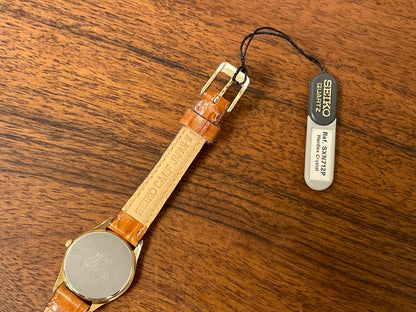 (1993) Seiko 4N00-0591 dress watch - gold bezel w/ black dial and gold markers - small size (NOS)