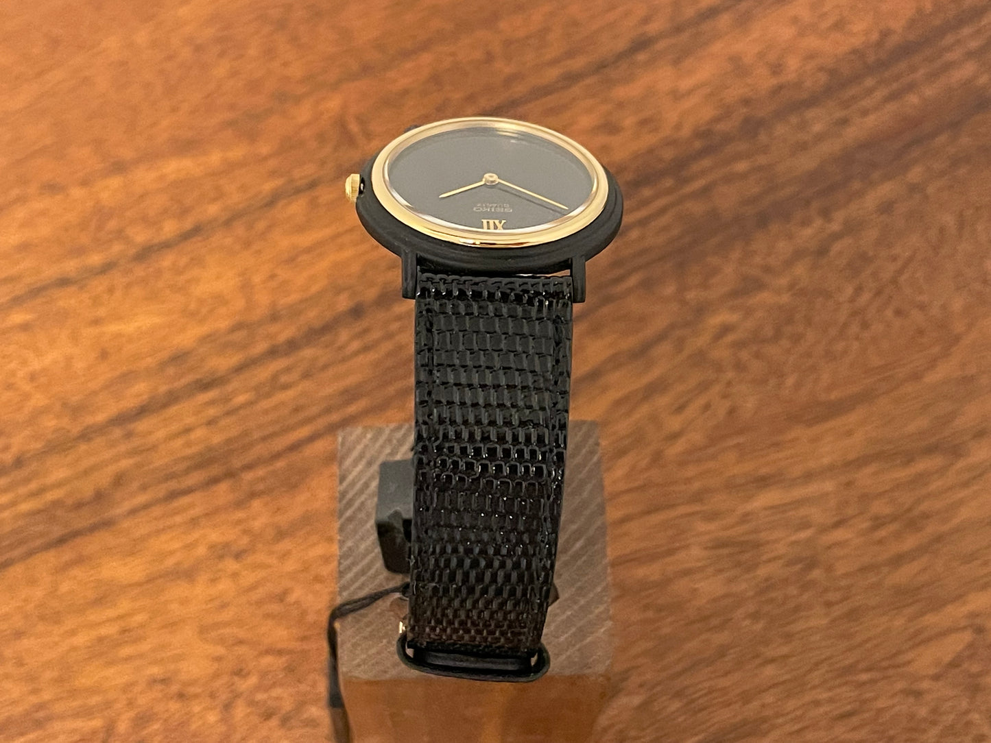 (1993) Seiko 6530-5120 dress watch- oval black case w/ gold bezel en hands (NOS)